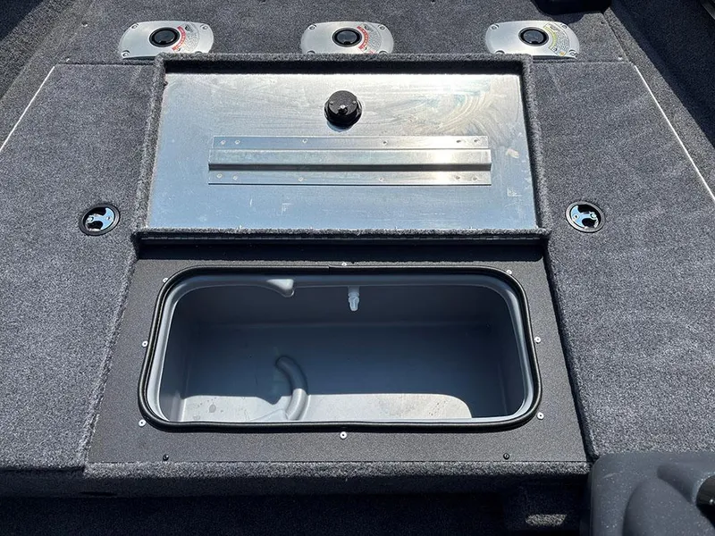 Slide: The Image of 2025 Tracker Pro Team 175 Crappie Edition boat storage compartments and gauges. - 13