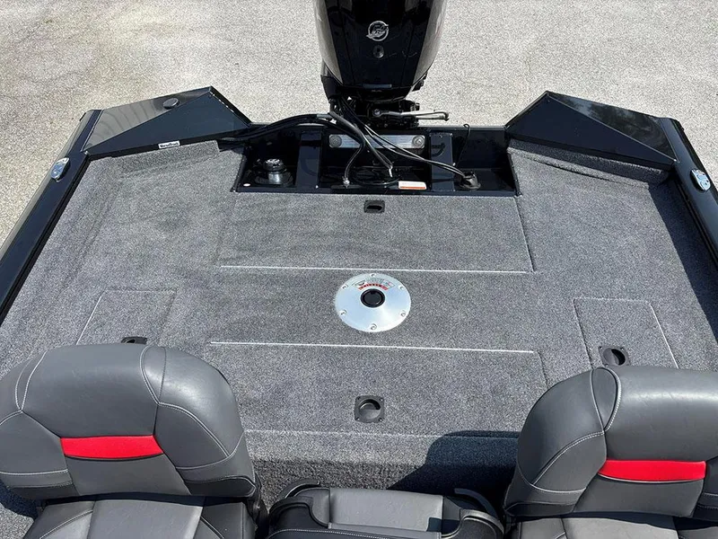 Slide: The Image of 2025 Tracker Pro Team 175 Crappie Edition boat interior with gray carpet and seating. - 18