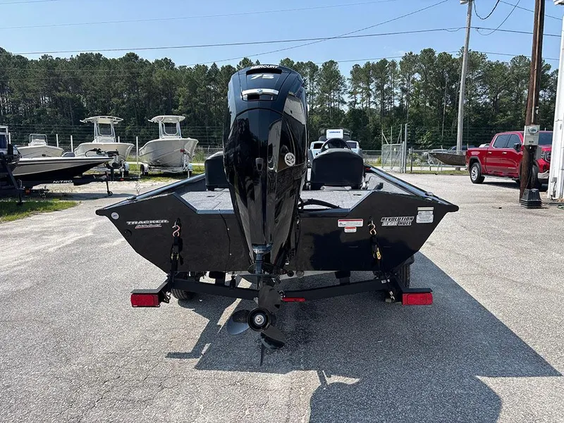 Slide: The Image of 2025 Tracker Pro Team 175 Crappie Edition boat, rear view, parked outdoors. - 22