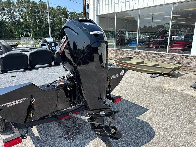 Slide: The Image of 2025 Tracker Pro Team 175 Crappie Edition boat with Mercury engine, parked outdoors. - 23