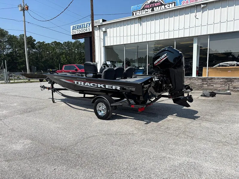 Slide: The Image of 2025 Tracker Pro Team 175 Crappie Edition boat on trailer outside dealership. - 3