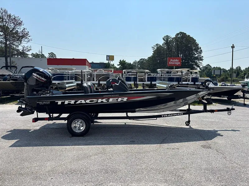 Slide: The Image of 2025 Tracker Pro Team 175 Crappie Edition boat in parking lot, side view. - 6