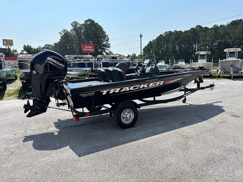 Slide: The Image of 2025 Tracker Pro Team 175 Crappie Edition boat with Mercury engine, parked outdoors. - 7