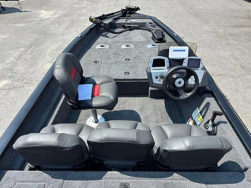 Slide: The Image of 2025 Tracker Pro Team 175 Crappie Edition boat interior with seating and control panel. - 8