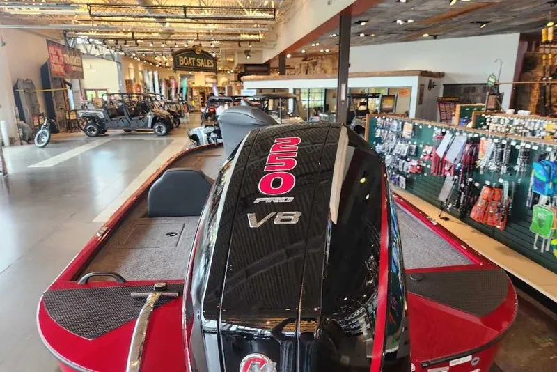 Slide: The Image of 2025 Tracker Savage 215 boat with 250 V8 engine in showroom. - 3