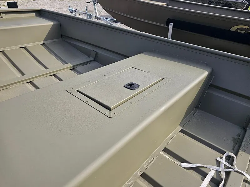 Slide: The Image of 2025 Tracker Grizzly 15 Jon boat interior, featuring a storage compartment and durable design. - 8