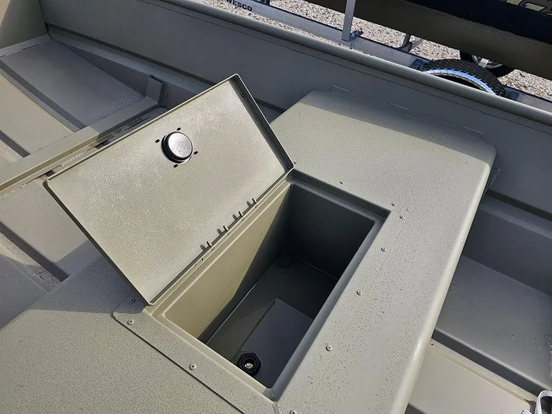 Slide: The Image of 2025 Tracker Grizzly 15 Jon boat storage compartment with open lid, showcasing interior space. - 9