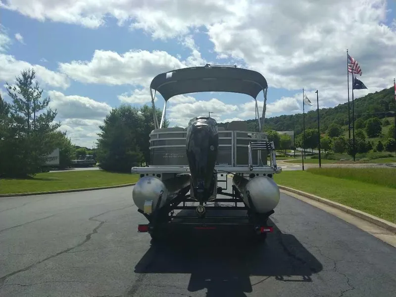 Slide: The Image of 2025 Sun Tracker Party Barge 20 DLX pontoon boat on a sunny day. - 3