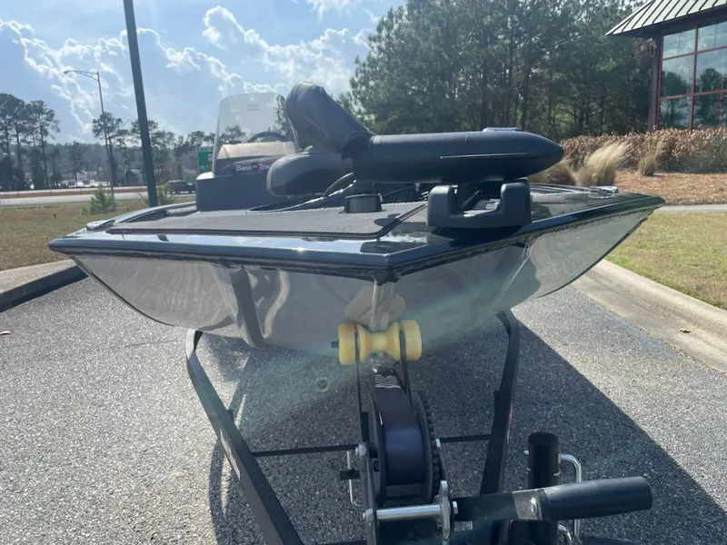Slide: The Image of 2025 Tracker Bass Tracker Classic XL boat on trailer, parked outdoors. - 2