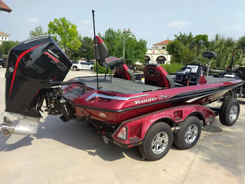 Slide: The Image of 2025 Ranger Z519R Cup-Equipped boat with Mercury Pro XS engine, parked outdoors. - 5