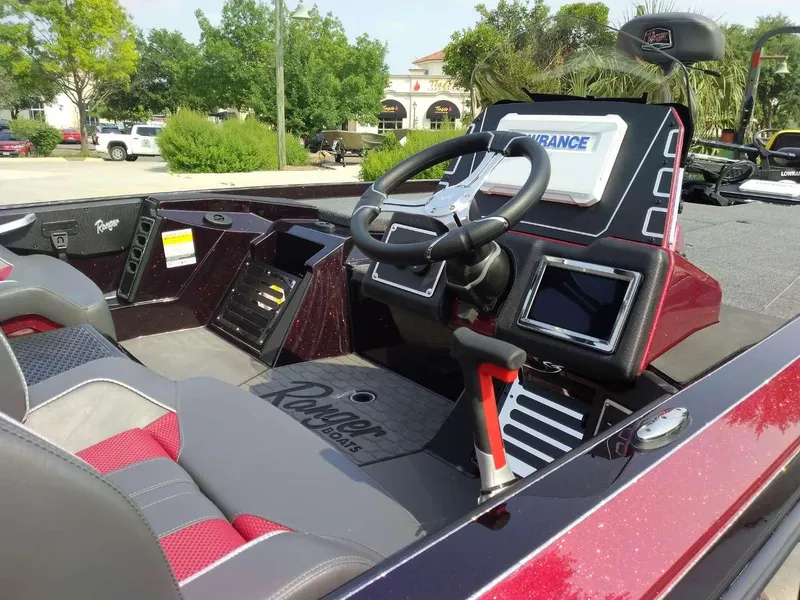 Slide: The Image of 2025 Ranger Z519R Cup-Equipped boat interior with steering wheel and dashboard. - 6