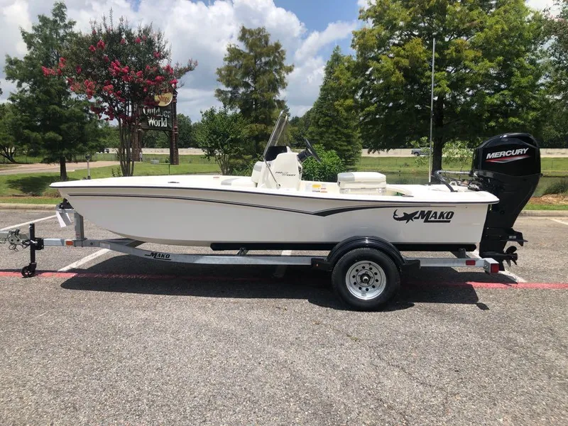 The Image of 2025 Mako Pro Skiff 15 CC boat on trailer, parked outdoors. - 0