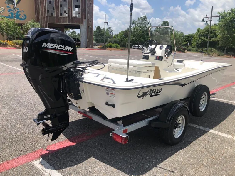 Slide: The Image of 2025 Mako Pro Skiff 15 CC boat with Mercury engine on trailer. - 5