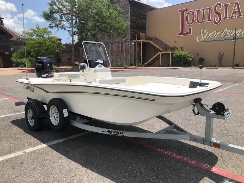 Slide: The Image of 2025 Mako Pro Skiff 15 CC boat on trailer in parking lot. - 7