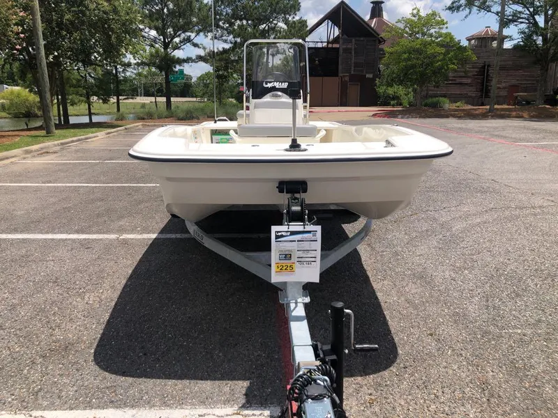 Slide: The Image of 2025 Mako Pro Skiff 15 CC boat on trailer in parking lot. - 8