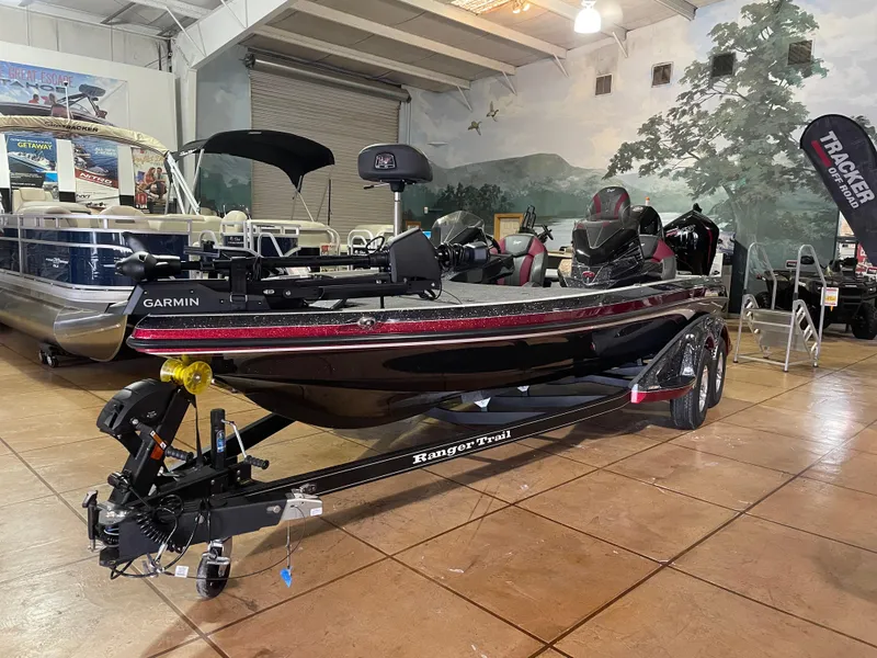 The Image of 2025 Ranger Z520 boat on trailer in showroom, featuring Garmin equipment. - 0