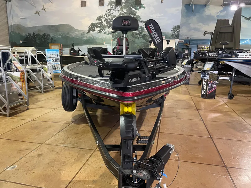 Slide: The Image of 2025 Ranger Z520 boat displayed in showroom with Garmin equipment. - 7