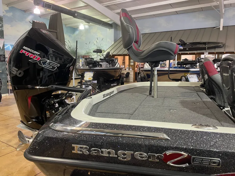 Slide: The Image of 2025 Ranger Z520 boat with Mercury Pro XS engine displayed in showroom. - 8