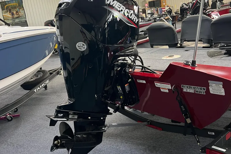 Slide: The Image of 2025 Tracker Pro Team 175 Crappie Edition boat with Mercury outboard motor in showroom. - 7