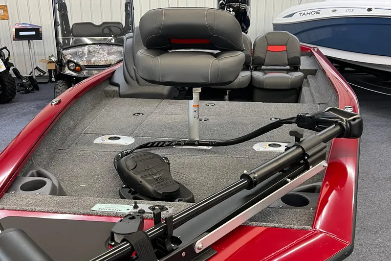 Slide: The Image of 2025 Tracker Pro Team 175 Crappie Edition boat with red exterior and fishing seats. - 8