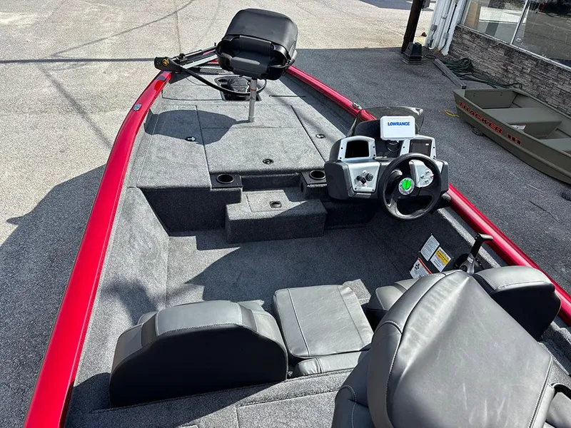 Slide: The Image of 2025 Tracker Pro Team 175 boat interior with steering console and seating. - 10