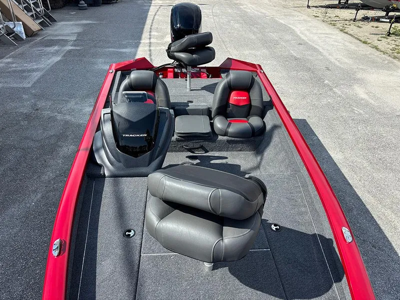 Slide: The Image of 2025 Tracker Pro Team 175 boat with red and black seating, viewed from above. - 11