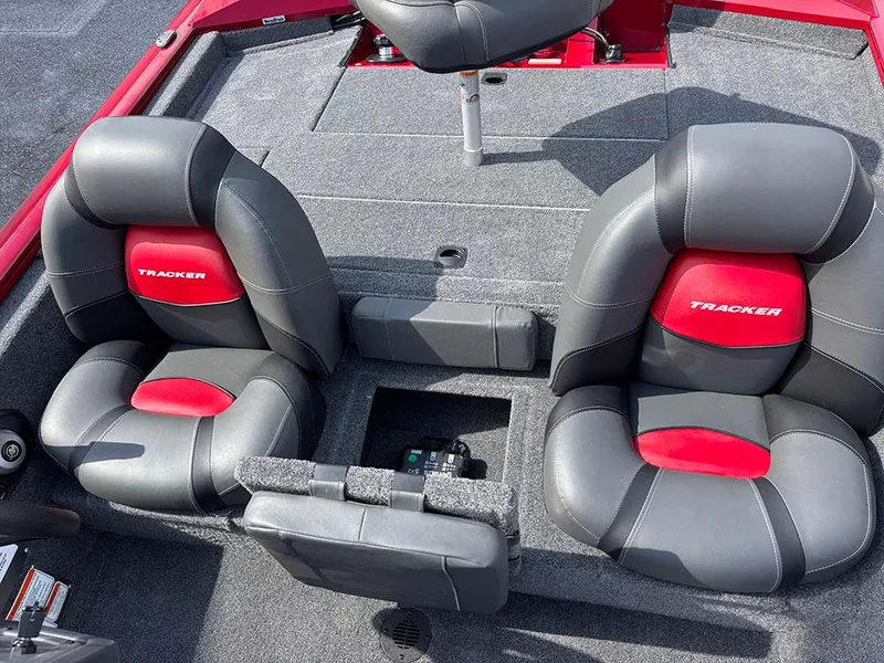 Slide: The Image of 2025 Tracker Pro Team 175 boat interior with two gray and red seats. - 16
