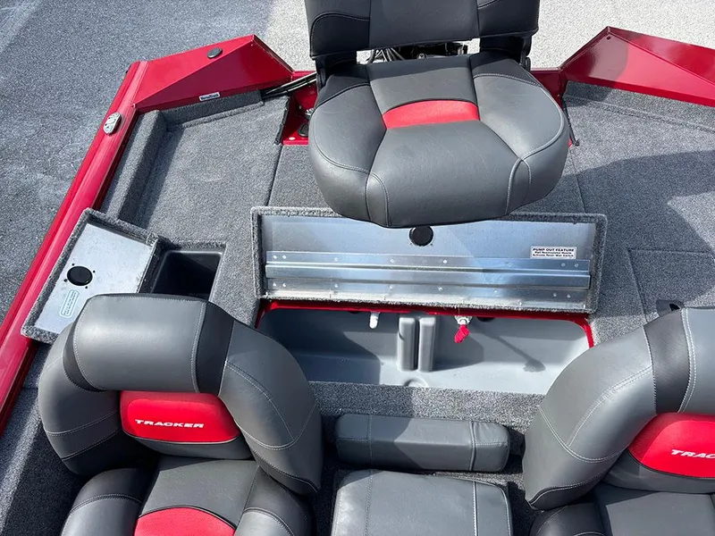 Slide: The Image of 2025 Tracker Pro Team 175 boat interior with black and red seating. - 19