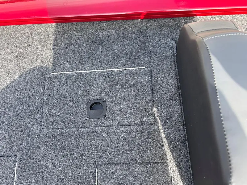 Slide: The Image of Carpeted deck of 2025 Tracker Pro Team 175 boat with storage compartment. - 21