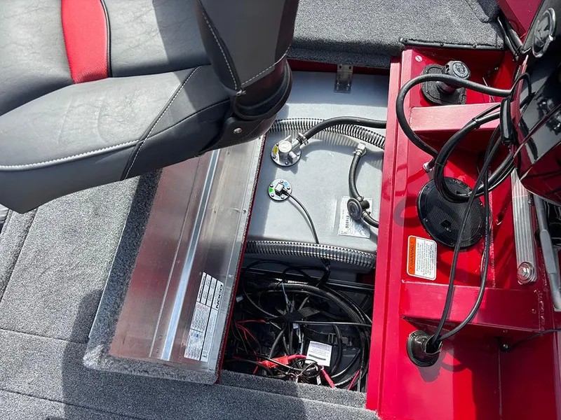 Slide: The Image of 2025 Tracker Pro Team 175 boat interior showing seat and wiring compartment. - 23