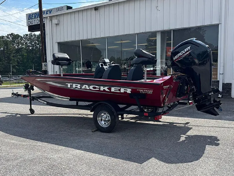 Slide: The Image of 2025 Tracker Pro Team 175 boat with Mercury engine, parked outside dealership. - 7