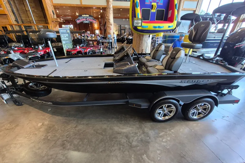 The Image of 2025 Ranger ALPHA 208 boat displayed in a showroom with modern seating and sleek design. - 0