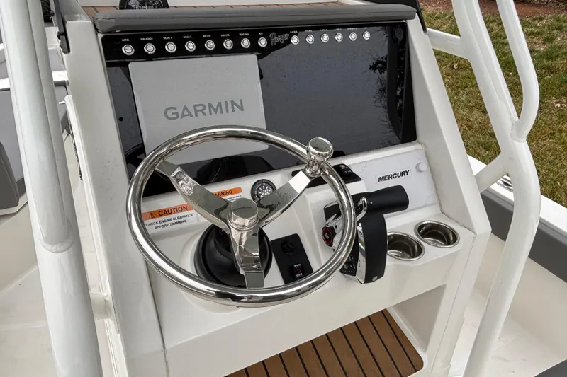 Slide: The Image of 2025 Ranger 2360 Bay boat console with Garmin navigation and Mercury controls. - 5