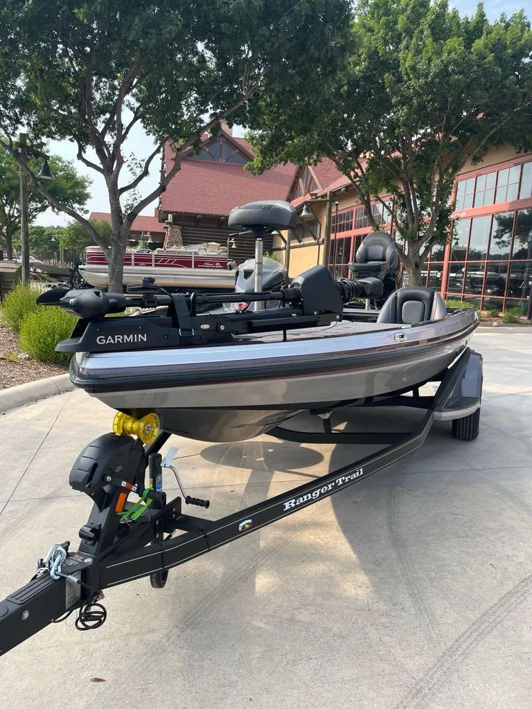 Slide: The Image of 2025 Ranger Z518 Cup-Equipped boat on trailer, parked outdoors near building. - 1