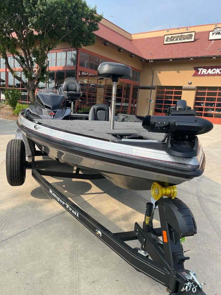Slide: The Image of 2025 Ranger Z518 Cup-Equipped boat on trailer outside dealership. - 2