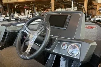 Slide: The Image of 2025 Ranger Z518 Cup-Equipped boat dashboard with steering wheel and gauges. - 6