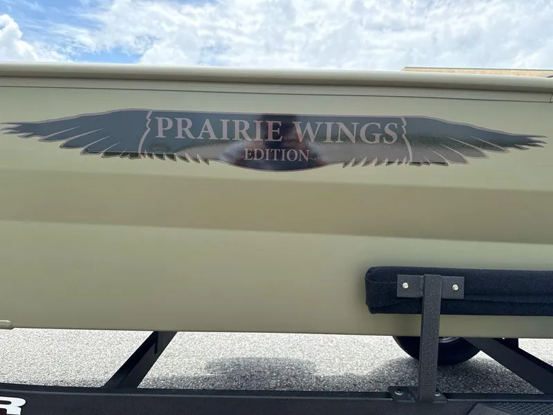 Slide: The Image of 2025 Tracker Grizzly 1650 T Prairie Wings Edition boat with wing decal. - 2