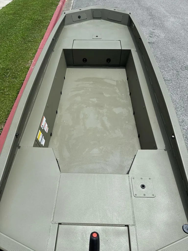 Slide: The Image of 2025 Tracker Grizzly 1650 T Prairie Wings Edition boat interior, empty and ready for use. - 3