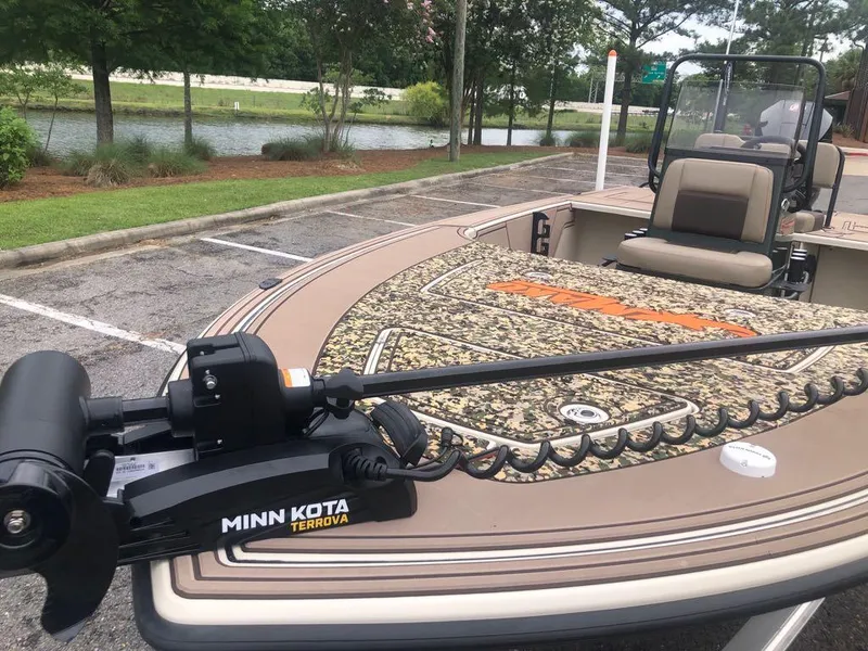 Slide: The Image of 2025 Mako 18 Pro Skiff Backwater Edition with Minn Kota Terrova motor in parking lot. - 10