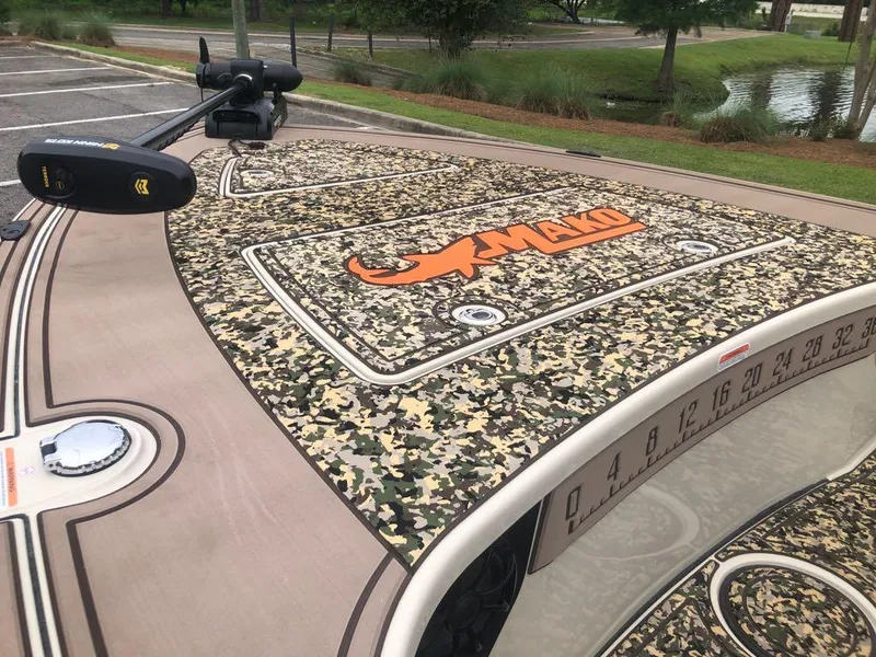 Slide: The Image of 2025 Mako 18 Pro Skiff Backwater Edition with camouflage deck and logo. - 11