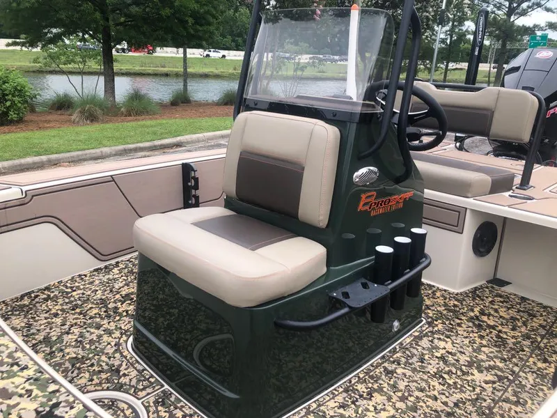 Slide: The Image of 2025 Mako 18 Pro Skiff Backwater Edition boat with seating and steering console. - 12