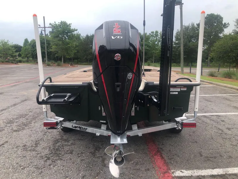 Slide: The Image of 2025 Mako 18 Pro Skiff Backwater Edition with V6 engine in parking lot. - 3