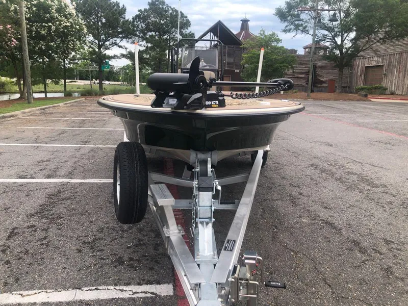 Slide: The Image of 2025 Mako 18 Pro Skiff Backwater Edition on trailer in parking lot. - 9