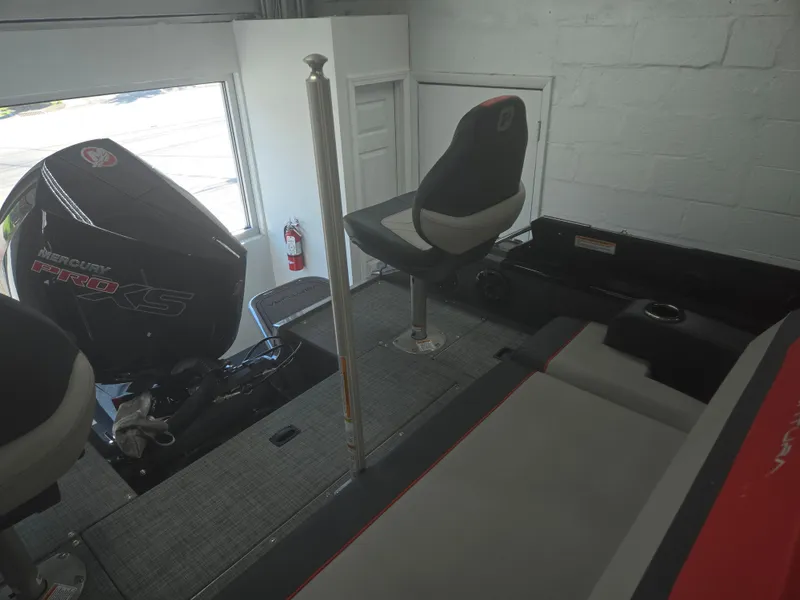 Slide: The Image of 2025 Princecraft Ventura 230 WRL interior with seating and motor, showcasing modern design. - 14