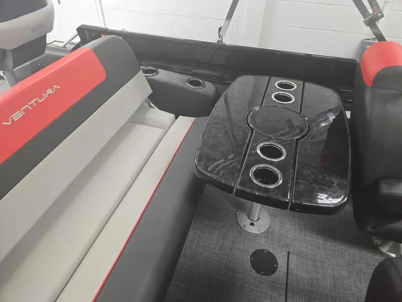 Slide: The Image of Interior of 2025 Princecraft Ventura 230 WRL boat with seating and table. - 17