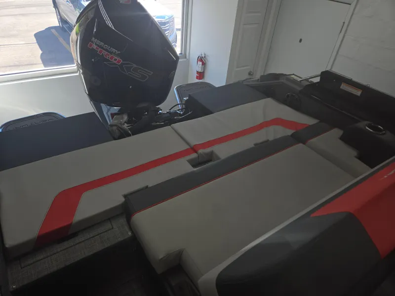 Slide: The Image of 2025 Princecraft Ventura 230 WRL boat interior with seating and outboard motor. - 19