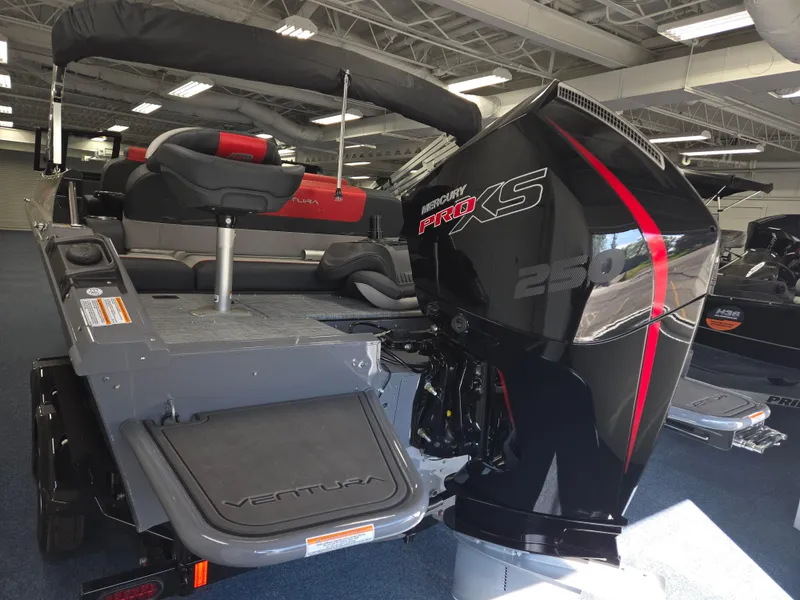 Slide: The Image of 2025 Princecraft Ventura 230 WRL boat with powerful Mercury Pro XS engine in showroom. - 5