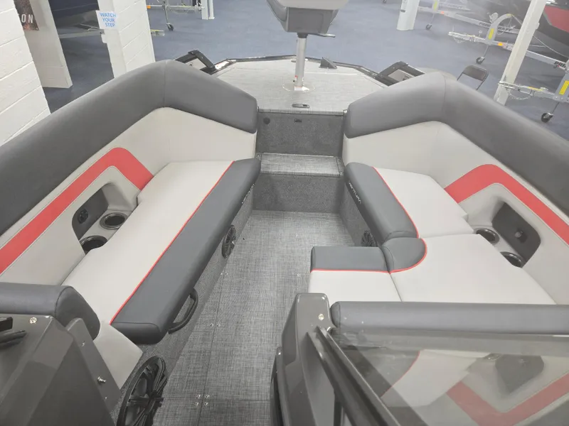 Slide: The Image of 2025 Princecraft Ventura 230 WRL boat interior with gray and red seating. - 7