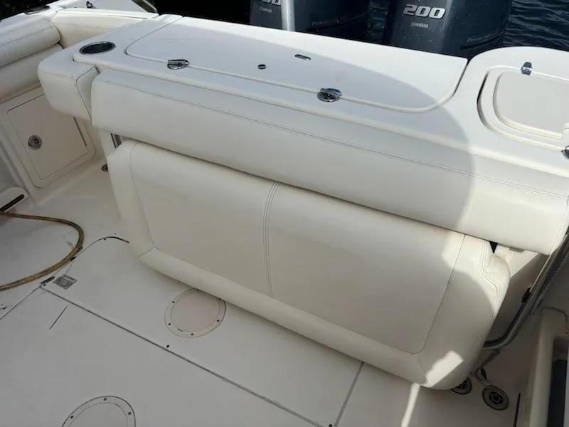 Slide: The Image of 2016 Grady-White Freedom 275 boat interior with seating and storage compartments. - 8