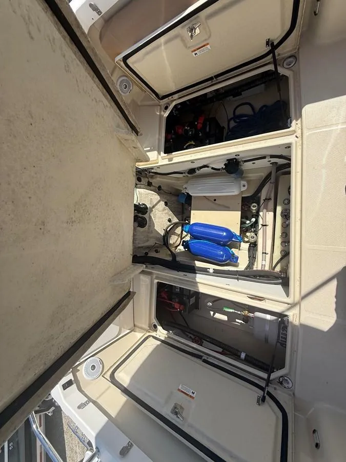 Slide: The Image of 2021 Ranger Tugs R-23 boat storage compartments with equipment and accessories. - 13